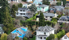 A view of single-family homes up an urban hillside