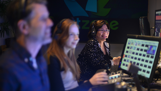 Susan Han smiles in Seattle Channel's studio control room.