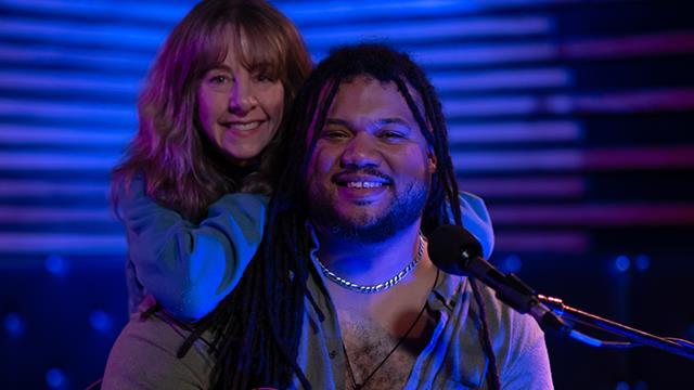 Nancy Guppy poses for a photo with musician Ethan Tucker.