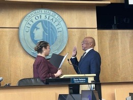 Color photo of City Clerk Scheereen Dedman swearing in Mark Solomon