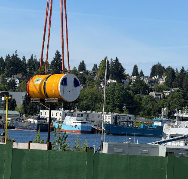 Tunnel boring machine lifted off the truck and into the site.
