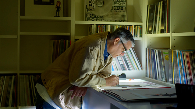 Jeff Kleinsmith works at a light table.