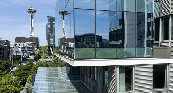 An office building with the Space Needle in the background