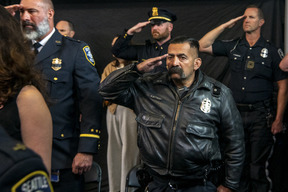 Officers in uniform saluting