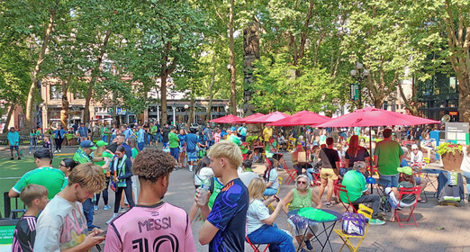 People at Occidental Park during a soccer match