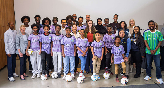 Seattle Mayor Katie B. Wilson with community leader and youth after announcing initiative to give youth access FIFA World Cup Matches