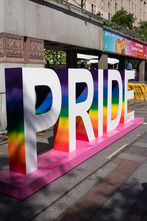 Photo of PRIDE logo at parade