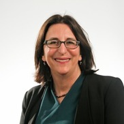 white woman with dark hair and glasses