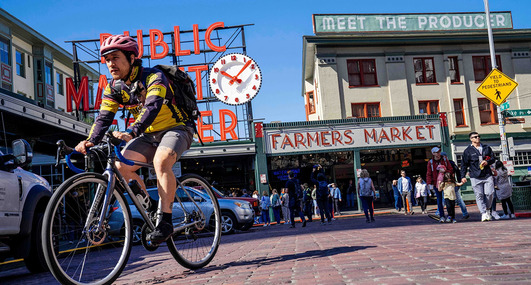 A person biking at Pike Place Market