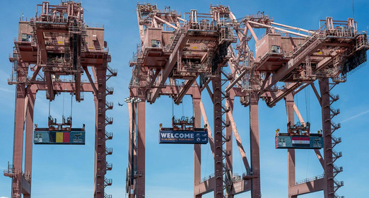 Giant banners hang on Seattle ports to welcome visitors to FIFA