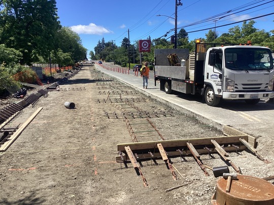 A photo of crews grading where new concrete panels will be poured.
