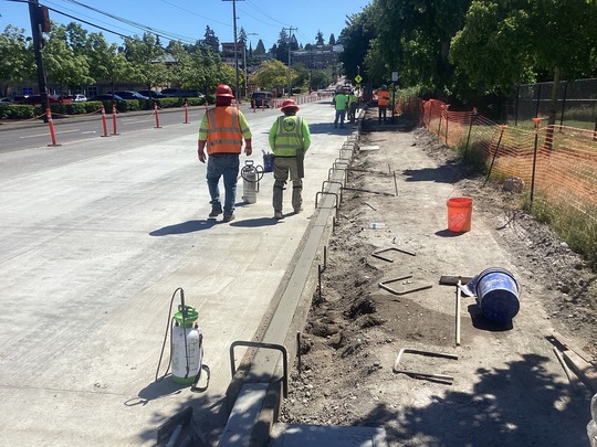 Crews working to finish concrete pouring on SW Barton St.