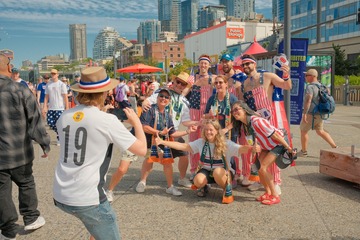 Soccer fans posing for a photo at the waterfront