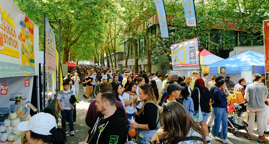 People browsing through food vendors at the Bite of Seattle