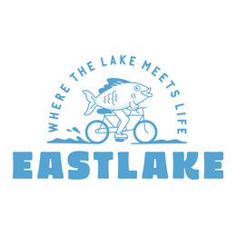 Logo with illustration of fish riding a bike with text saying "where the lake meets life: Eastlake."