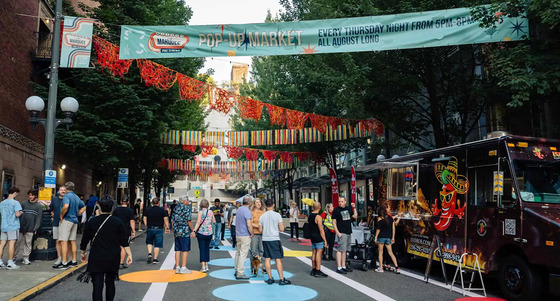People walking around the "Market at the Marquee" pop-up market