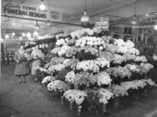 black and white photo of flower stall in Pike Place Market, 1939