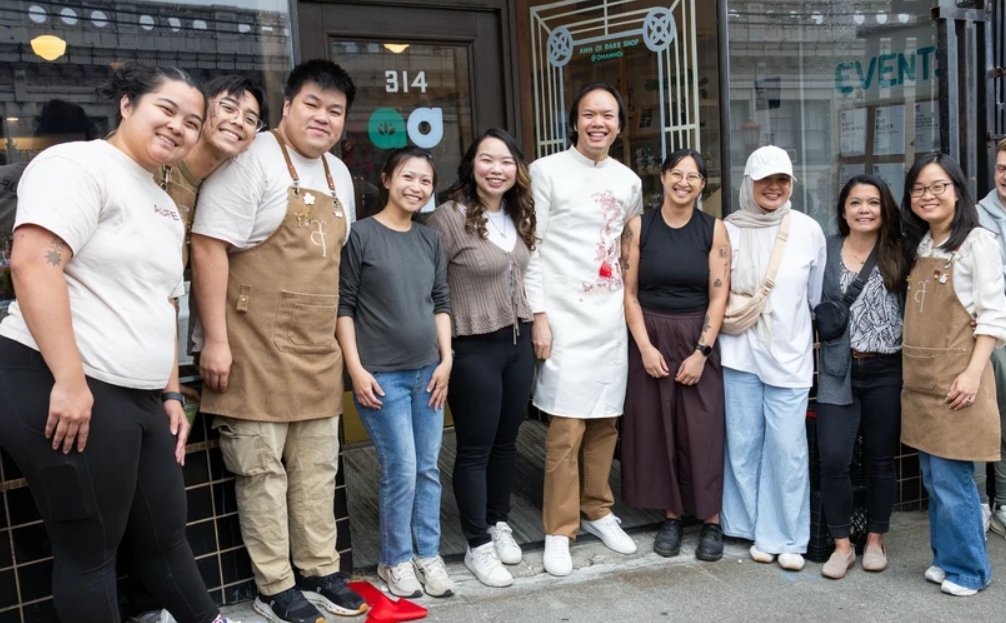 A group of bakers standing outside of Anh Oi Bake Shop