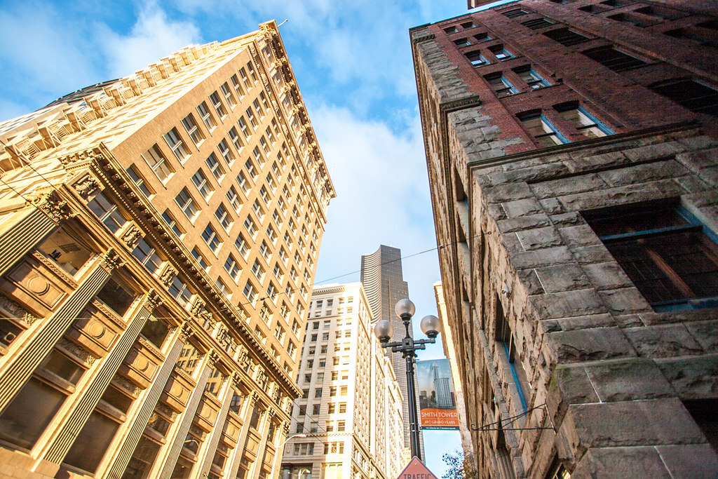 An image looking up at tall buildings in downtown Seattle