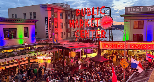 People enjoying music during "The Night Shift," a free monthly evening series celebrating local art, music, food at Pike Place Market