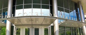 Up-close photo of Municipal Court of Seattle Sign that sits atop the front entrance of the courthouse. 