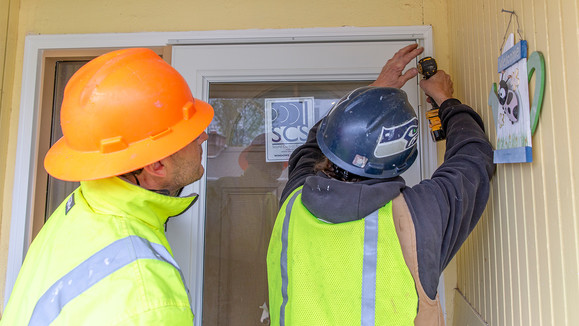 Noise Remediation specialists work to insulate a Burien home, April, 2019