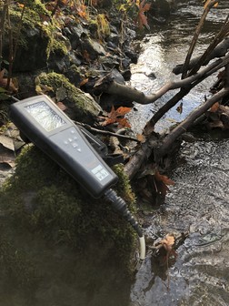water quality meter on a rock at Hansen Creek