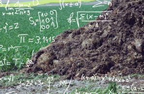 Photo of a manure pile in front of a grassy pasture. Superimposed over the pasture are mathematical symbols.