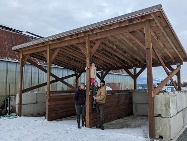 The Van Loo family in front of their newly built manure storage bin.