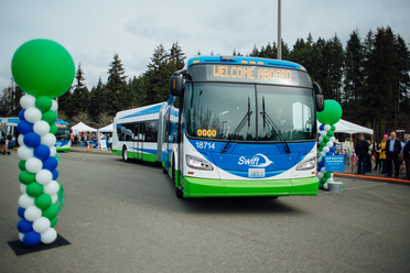 Image of Swift Green line bus at launch event