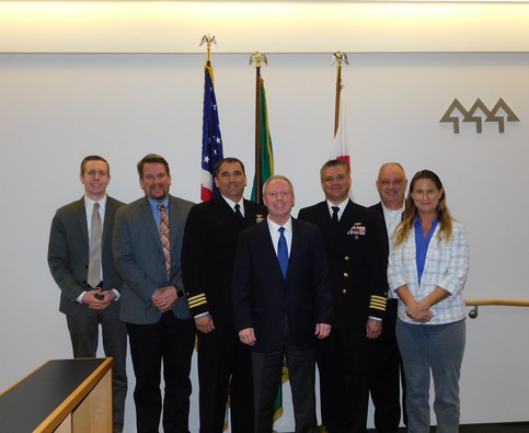 Image of councilmembers and Navy commanders