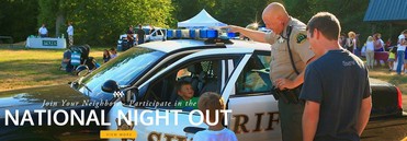 National Night Out Image of Officer and Child