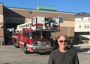 Councilmember Sullivan with the brand new ladder truck at Everett Station 1
