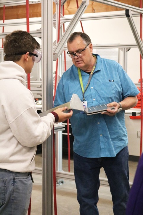 Photo of instructor at manufacturing lab