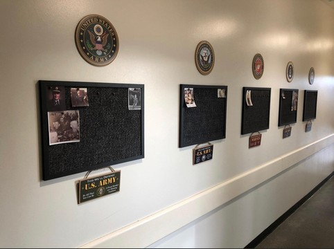 Photo of Veteran Wall featuring plaques for individuals who have served.