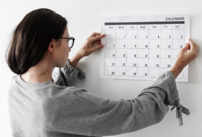 Woman looking at calendar