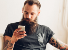 Man on phone looking up vaccination records