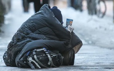 Homeless person outside in snow