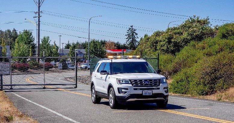 Paine Field vehicle waiting for gate to close completely before leaving