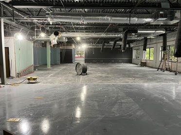 Interior of office building that is being renovated. Carpet and walls have been removed.