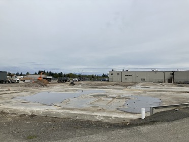 A clean concrete foundation at the southeast end of Paine Field after building demolition