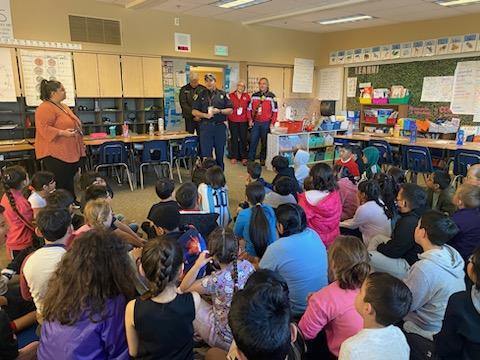 Firefighters present to a classroom of 2nd graders at Emerson Elementary in Everett, WA