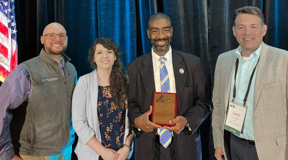 Auditor Fell, Elections Manager Matthew Pangburn, Public Information Officer Sierra Cornelius, and EAC Commissioner Hicks pose with 2023 Clearie Award