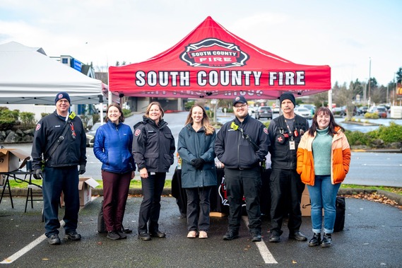 Partners gather in front of a South County Fire canopy at a Narcan distribution event in November.