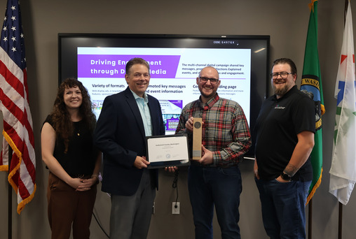 Elections team holds up the Independence Award