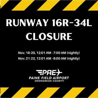 Yellow and black caution notice of main runway closure overnight Nov. 18-22