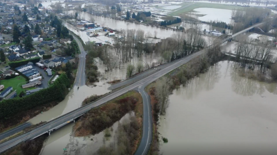 Aerial view of flooding over roads, fields, and buildings near Snohomish