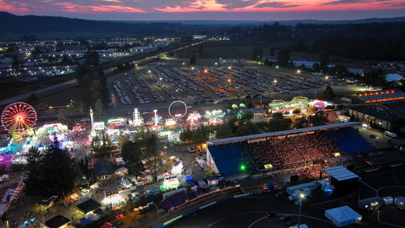 Aerial view of 2025 Evergreen State Fair around sunset.