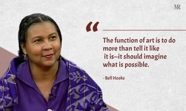 Photo bell hooks in purple clothing smiling