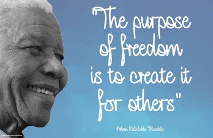 Black and white photo of Nelson Rohilahla Mandela with his quote, "The purpose of freedom is to create it for others."